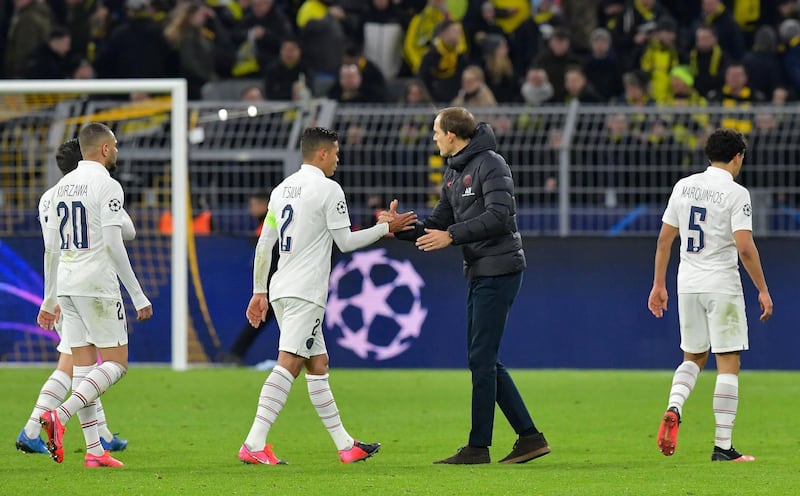 Thomas Tuchel shakes hands with his players after the end of the match. AFP