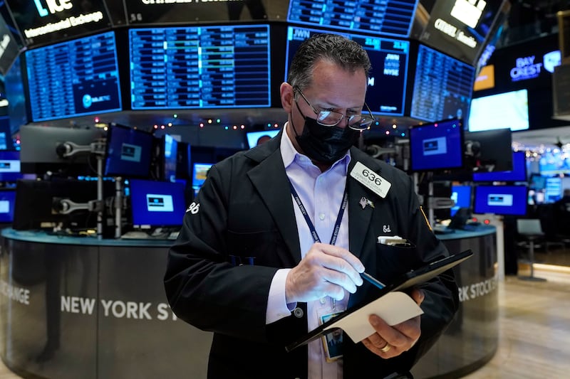 A trader on the floor of the New York Stock Exchange. Stocks rallied on Wall Street as investors hoped that the Omicron coronavirus variant will not pose a big economic threat. AP