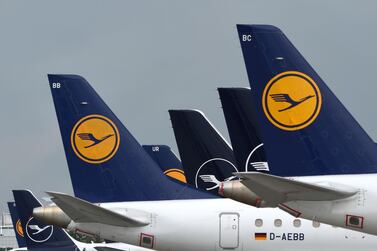 The tails of aircraft of the German airline Lufthansa are seen at the "Franz-Josef-Strauss" airport in Munich, southern Germany, on June 11, 2020. German airline Lufthansa said on June 11, 2020 that it would have to slash 22,000 full-time jobs as the recovery in demand for travel following the coronavirus pandemic will be muted. / AFP / Christof STACHE
