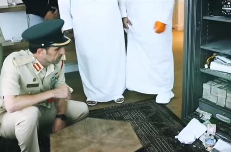 Dubai Police chief Mohammed Khalifa Al Marri inspects the safe. Police said the suspect was only able to fit Dh3 million of the estimated Dh10m in his case. Courtesy: Dubai Police