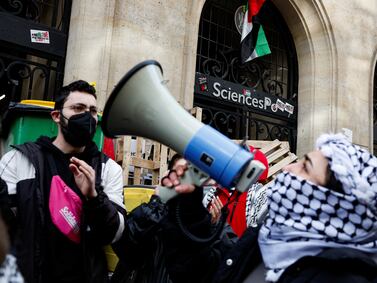 Masked youths take part in a protest outside a building of the Sciences Po University in Paris, France, France. Reuters
