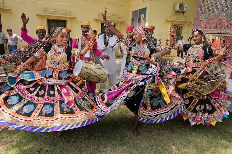 Folk artists from Rajasthan perform a traditional dance during an alumni meeting at the University of Allahabad in Prayagraj, Uttar Pradesh, India. AP