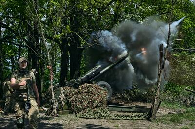 Ukrainian soldiers fire a cannon near Bakhmut, an eastern city where fierce battles against Russian forces have been taking place. AP
