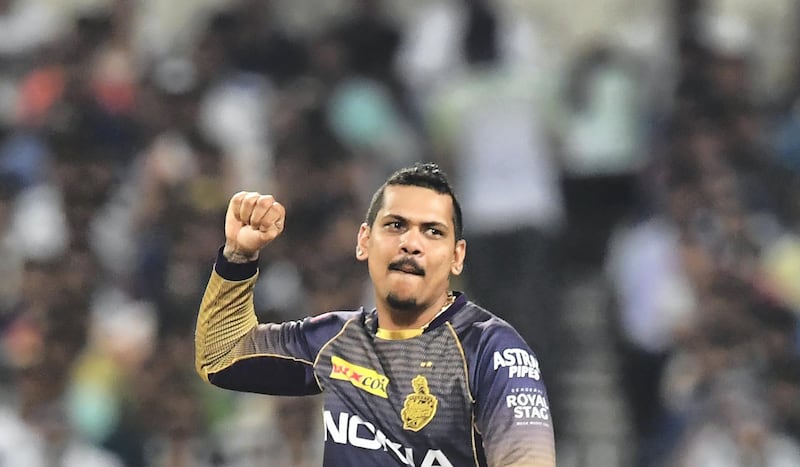 Kolkata Knight Riders's cricketer Sunil Narine celebrates after taking the wicket of Rajasthan Royals' cricketer Ajinkya Rahane during the 2019 Indian Premier League (IPL) Twenty 20 cricket match between Kolkata Knight Riders and Rajasthan Royals at the Eden Gardens Cricket Stadium, in Kolkata, on April 25, 2019. (Photo by DIBYANGSHU SARKAR / AFP) / IMAGE RESTRICTED TO EDITORIAL USE - STRICTLY NO COMMERCIAL USE