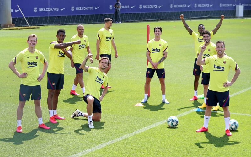 Barcelona players pose for a photo during a training session at Ciutat Esportiva Joan Gamper. Getty Images