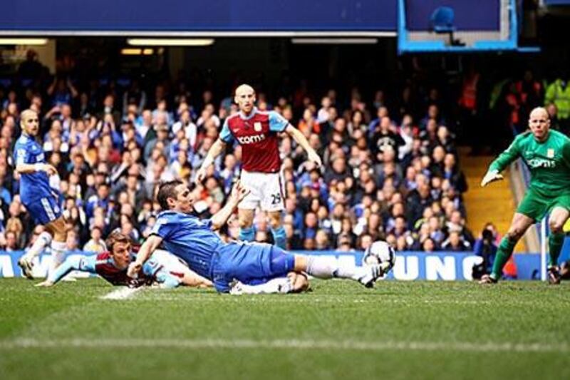 Frank Lampard slides in at the back post to convert a cross from Florent Malouda and score the first of his four goals.