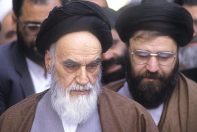 Tehran, Iran: Ayatollah Ruhollah Khomeini (L) the leader and founder of Islamic Republic of Iran, looking frail votes for parliament election, in his residence Jamaran, in north Tehran 8th April 1988. His son Ahmad (R) stands next to him. (Photo by Kaveh Kazemi/Getty Images)  