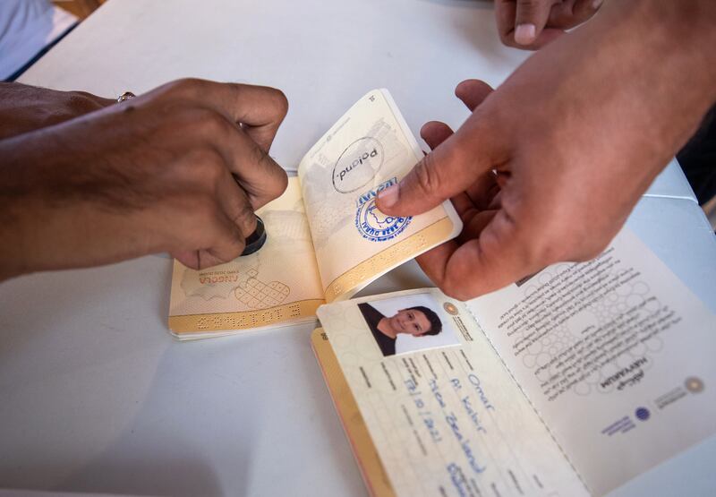 Visitors get their passports stamped at the Italy pavilion. Victor Besa/The National.