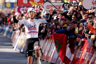 Slovenia's Tadej Pogacar of the UAE Emirates team crosses the finish line to win the Belgian cycling classic and UCI World Tour race Liege Bastogne Liege, in Liege, Belgium, Sunday, April 21, 2024.  (AP Photo / Geert Vanden Wijngaert)