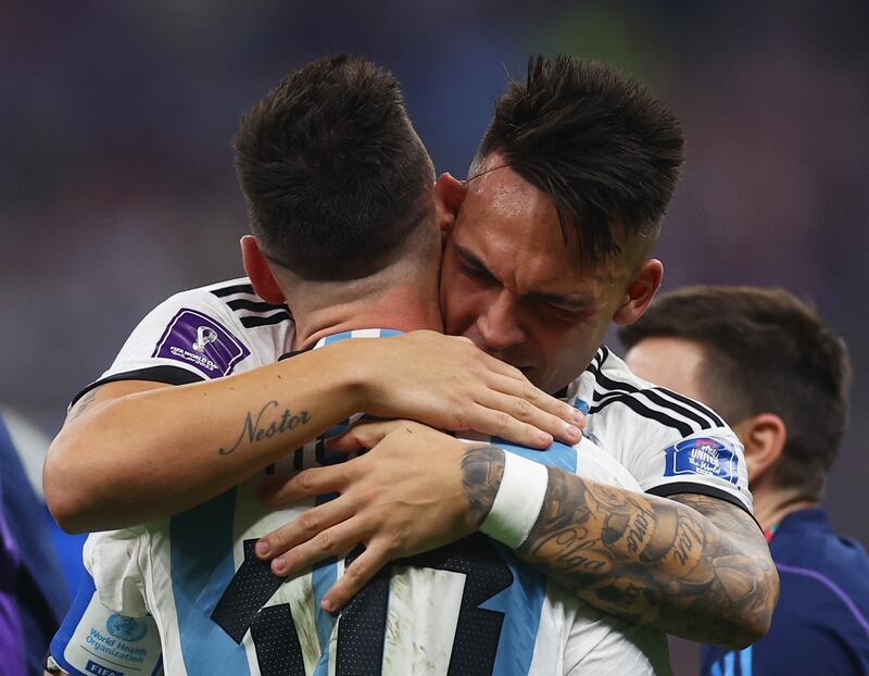 Argentina's Lautaro Martinez and Lionel Messi celebrate after winning the World Cup. Reuters