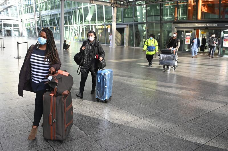 Passengers are escorted by security to a coach destined for the Radisson Blu Hotel near Heathrow airport. EPA / Getty