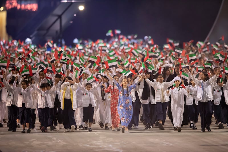 Children participate in the 51st UAE National Day show at Abu Dhabi National Exhibition Centre. Presidential Court