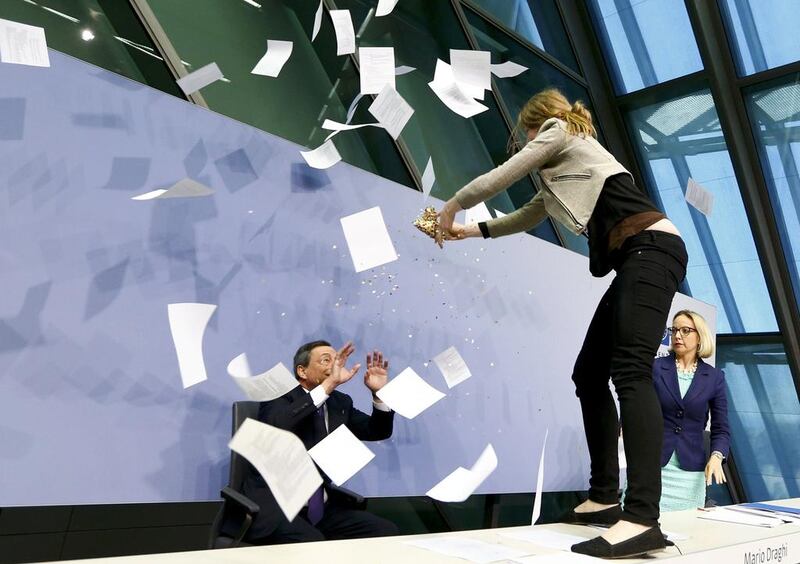 The meeting turns into a shower of paper and confetti. Ralph Orlowski / Reuters