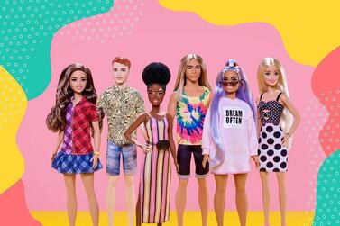 The newest additions to Barbie's Fashionista ine include a doll with alopecia, centre, and a redheaded Ken. Instagram / Barbie