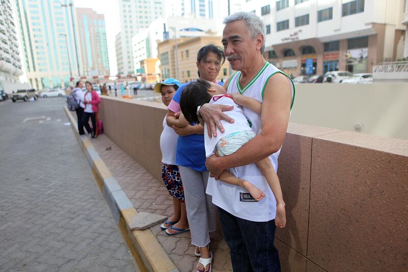 April 16, 2012 (Abu Dhabi) Rolando Banzon holding his daughter Alyssa, 3, his wife Analissa and son Ali, 6,  evacuated their apartment buildings after a 7.8 magnitude earthquake originating in Iran was also felt in Abu Dhabi April 16, 2013. (Sammy Dallal / The National)