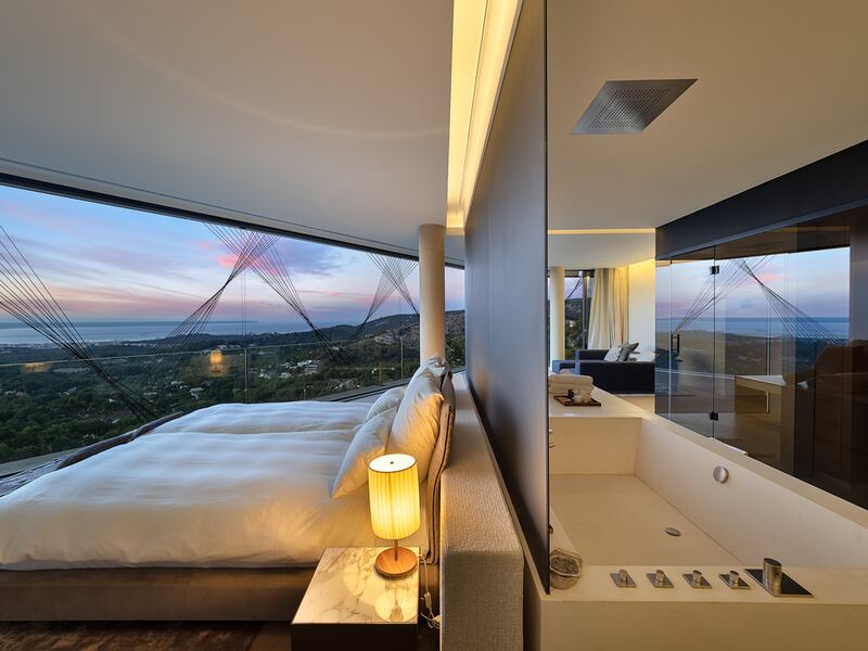 A bedroom with panoramic views of the Balearic island's coast.