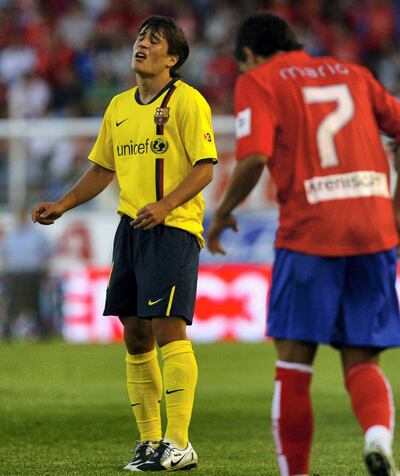 Barcelona's Bojan Krkic, left, reacts after missing to score against Numancia during their Spanish league soccer match at Los Pajaritos Stadium in Soria, Spain, on Sunday, Aug. 31, 2008. To the right is Numancia's Mario Martinez Rubio. Numancia won 1-0. (AP Photo/I.Lopez)