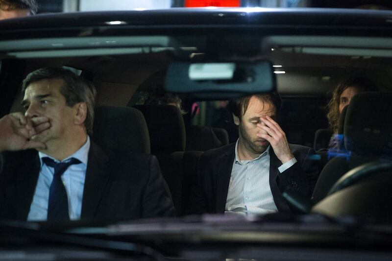 Argentine finance secretary Pablo Lopez, centre, leaves negotiations on Tuesday aimed at avoiding his country’s second default in 13 years. Argentina has defaulted for the second time in 13 years after officials failed to come to an agreement with the country's bondholders. John Minchillo / AP Photo