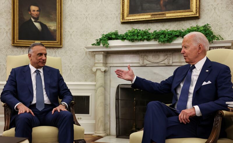 US President Joe Biden speaks with Iraq's Prime Minister Mustafa Al Kadhimi during a bilateral meeting at the White House.
