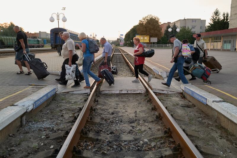 Displaced Ukrainian citizens from Russian-occupied territories board a train to Kyiv from Sumy, north-east Ukraine, in September. Getty Images