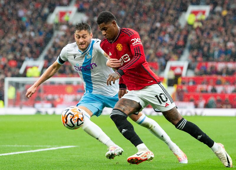Crystal Palace's Joel Ward battles for the ball with Manchester United's Marcus Rashford. EPA