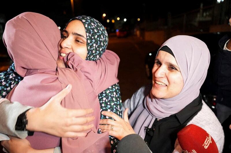 Ms Bakir is reunited with her family through the swap deal between Hamas and Israel. Reuters