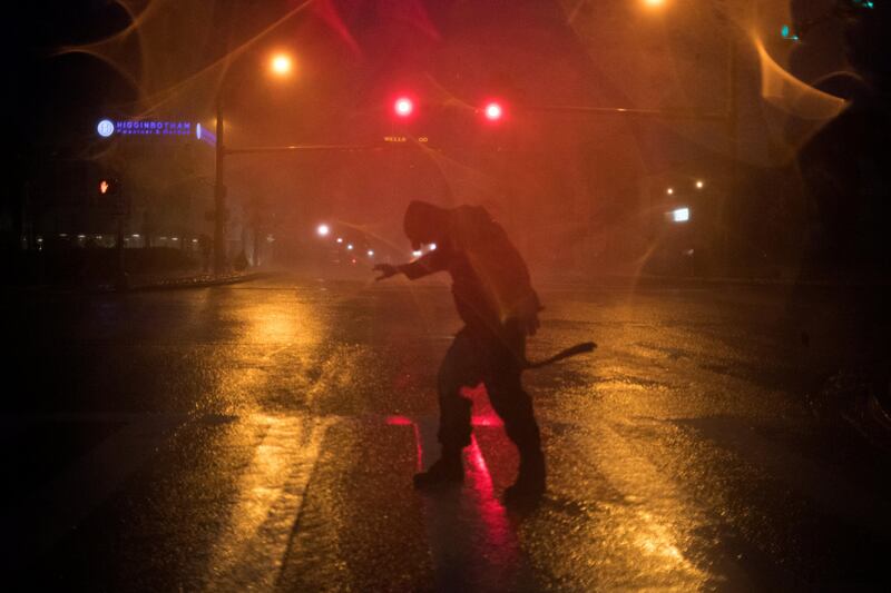 Stewart Adams, of San Marcos, Texas, plays in the winds from Hurricane Harvey in Corpus Christi, Texas. Adrees Latif / Reuters