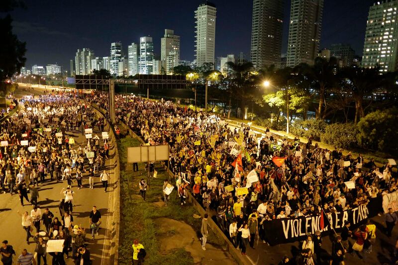 Protestors march in Sao Paulo, Brazil, Monday, June 17, 2013. Protesters massed in at least seven Brazilian cities Monday for another round of demonstrations voicing disgruntlement about life in the country, raising questions about security during big events like the current Confederations Cup and a papal visit next month. (AP Photo/Nelson Antoine) *** Local Caption ***  Brazil Confed Cup Protests.JPEG-03ea8.jpg