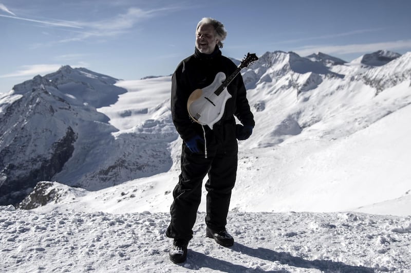 Tim Linhart poses with an ice mandolin on Cima Presena on the top of Presena Glacier, Tonale Pass. AFP