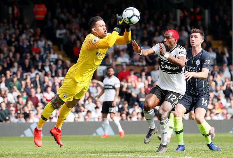 Manchester City's Ederson in action with Fulham's Ryan Babel. Reuters