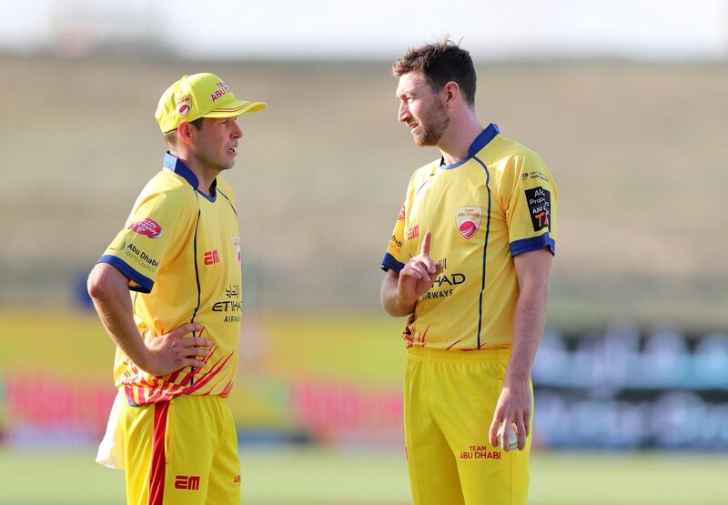 Abu Dhabi, United Arab Emirates - November 17, 2019: Abu Dhabi's Richard Gleeson speaks with team mate Ben Laughlin (L) during the game between Team Abu Dhabi and The Northern Warriors in the Abu Dhabi T10 league. Sunday the 17th of November 2019. Zayed Cricket Stadium, Abu Dhabi. Chris Whiteoak / The National