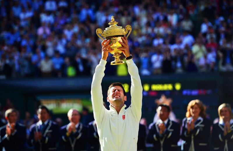 Novak Djokovic is thrilled to win his second Wimbledon title shortly before he is to become a father. Carl Court / AFP