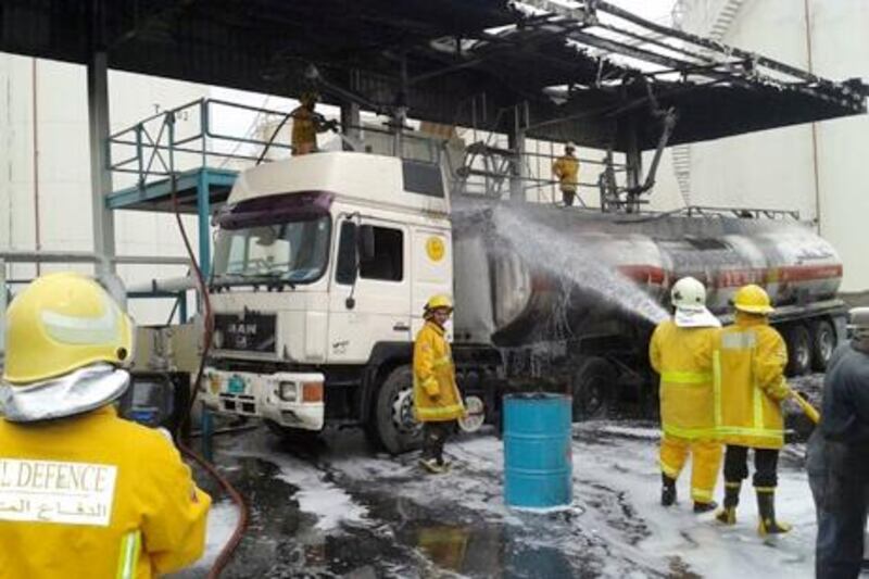 March 25, 2013-  Hamriya , Sharjah  firefigters putting out a fire at a diesel depot 

Yasin Kakande/ The National 
