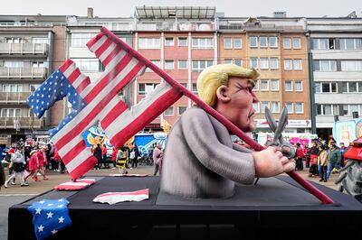 A carnival float depicting Donald Trump with a USA flag cut in the shape of a Nazi swastika at the carnival parade in Duesseldorf, Germany. AP
