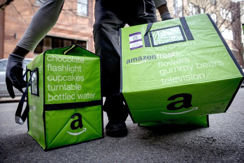 An Amazon worker delivers groceries from the Amazon Fresh service in the Brooklyn Borough of New York. The service has just been launched in parts of London. Brendan McDermid/Reuters 