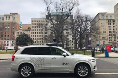 An Uber car equipped with cameras and sensors drives the streets of Washington. The company agreed to sell its autonomous car division to Aurora in a deal that gives the ride-hailing giant a stake in the start-up. AFP