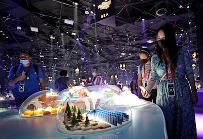 People visit a miniature exhibition at the Japan pavilion at Expo 2020 in Dubai. Photo: AP 