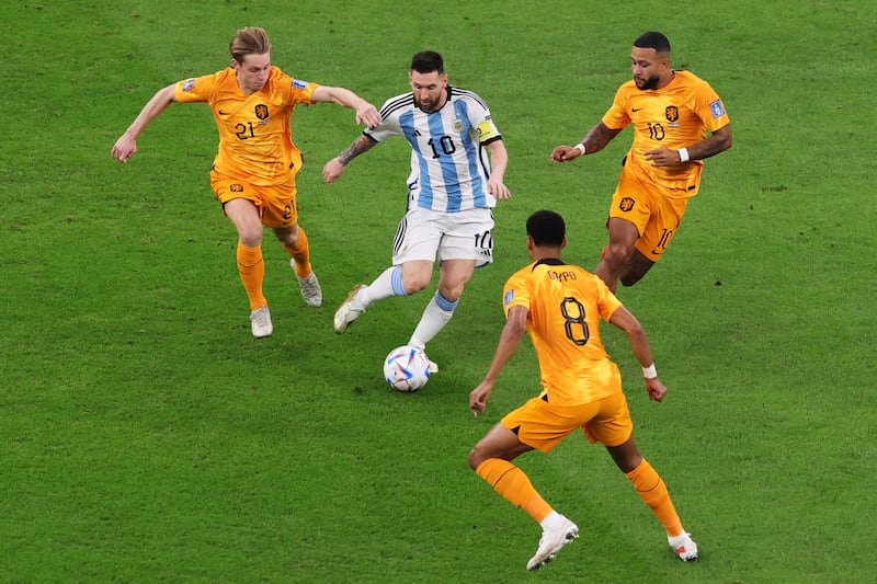 Argentina's Lionel Messi surrounded by Cody Gakpo, Memphis Depay and Frenkie de Jong of the Netherlands. EPA