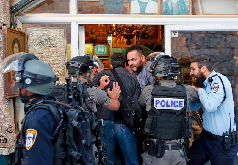 Israeli forces scuffle with people in Jerusalem's Old City. Thomas Coex / AFP Photo