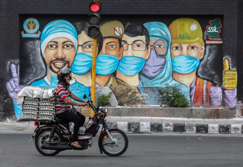 A mural of frontline workers in New Delhi. AFP