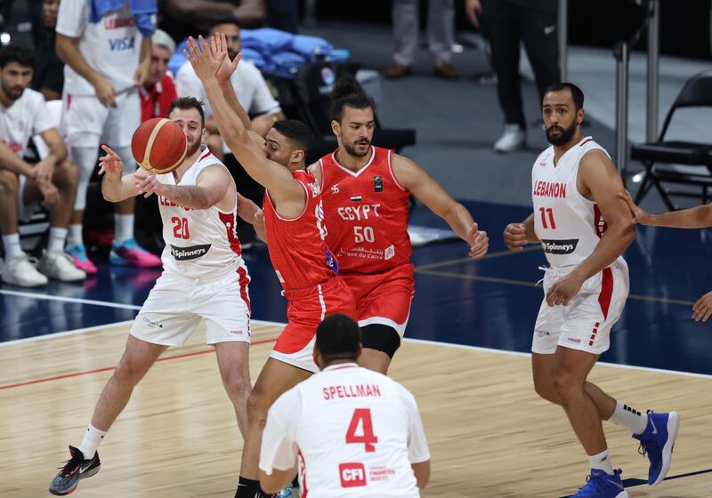 Egypt (in red) take on Lebanon (white) during the International Basketball Week in Abu Dhabi on August 17 2023. EPA