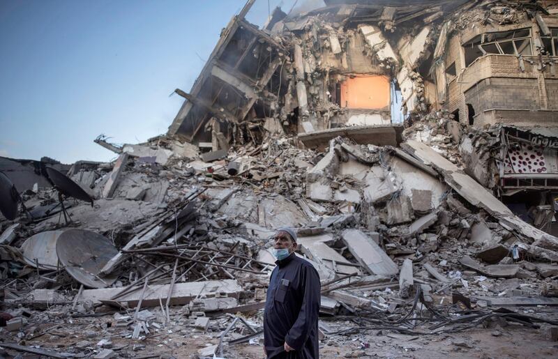 A Palestinian man looks at the destruction caused by Israeli airstrikes in Gaza city. Gaza is braced for more Israeli airstrikes as communal violence rages across Israel after weeks of protests and violence in Jerusalem. AP