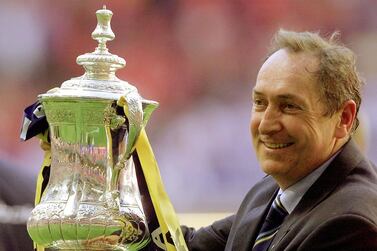 FILE PHOTO: Soccer Football - FA Cup Final - Liverpool v Arsenal - Millennium Stadium, Cardiff, Wales, Britain - May 12, 2001 Liverpool's manager Gerard Houllier holds aloft the FA Cup REUTERS/Ian Hodgson/File Photo