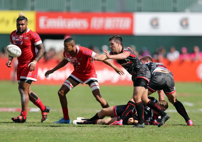 Exiles' Conor Kennedy passes the ball.