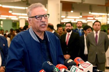 In this Oct. 28, 2018 file photo, Pakistan's President Arif Alvi speaks to journalists prior to departing to Turkey, in Islamabad, Pakistan. On Tuesday, Dec. 15, 2020, Alvi issued a much-awaited new law requiring the establishment of special courts to speedily conclude trials of people charged with raping women or children,. Press Information Department/AP.