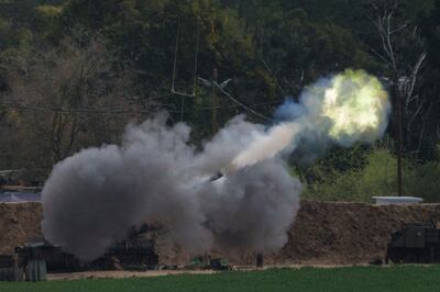 An Israeli mobile artillery unit fires a shell towards the Gaza Strip from a position near the Israel-Gaza border. AP