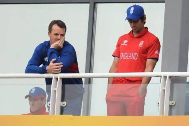 England captain Alastair Cook, right, with teammate Graeme Swann, watch on during England's game against New Zealand in the Champions Trophy. Philip Brown / Reuters