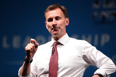 Conservative MP and leadership contender Jeremy Hunt gestures as he takes part in a Conservative Party Hustings event in Cheltenham, Gloucestershire in south west England on July 12, 2019.
  Britain's leadership contest is taking the two contenders on a month-long nationwide tour where they will each attempt to reach out to grassroots Conservatives in their bid to become prime minister. / AFP / CHRIS RADBURN
