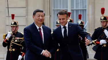 China's President Xi Jinping was greeted by France's Emmanuel Macron at the start of a state visit. Reuters