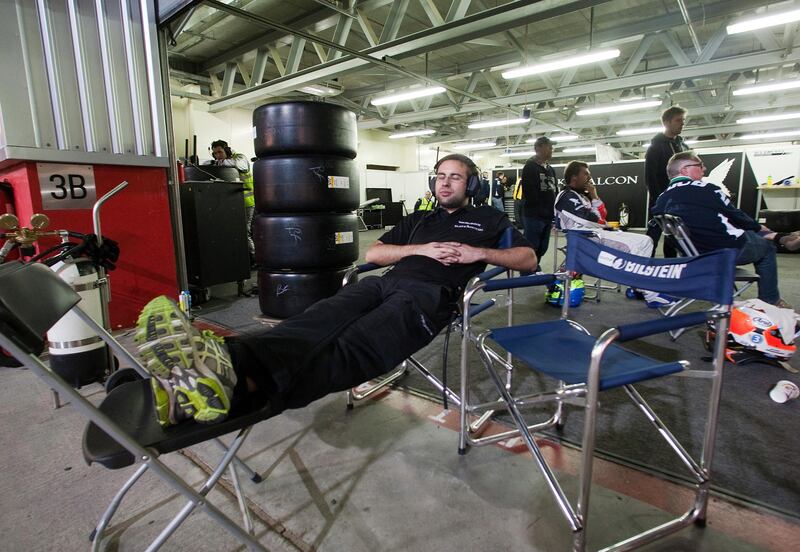 Dubai, United Arab Emirates, Jan 12 2013, 24h Dunlop , Night Pit Crews - As the 24h Dunlop enters its 14 hour, car crews show fatigue along pit row. Mike Young / The National??